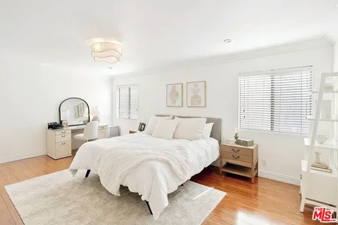 a bedroom with a bed and a table