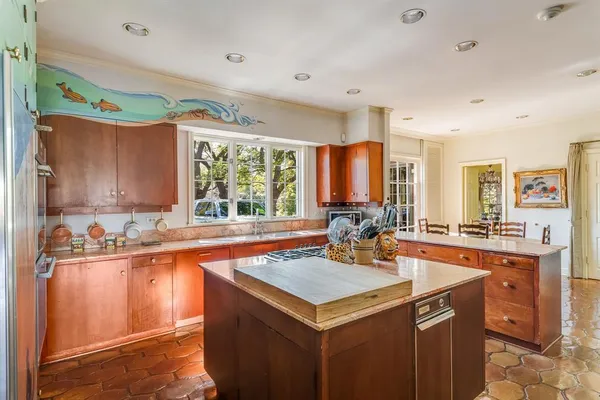 a kitchen with a sink stove and cabinets