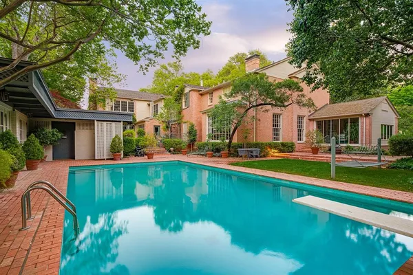 a front view of a house with plants