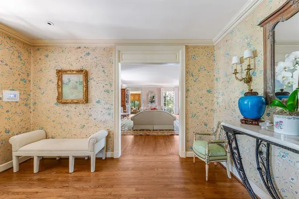 a view of living room filled with furniture and wooden floor