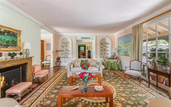a living room with furniture fireplace and a flat screen tv