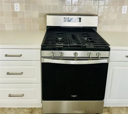 a view of a backyard with a garden and stairs