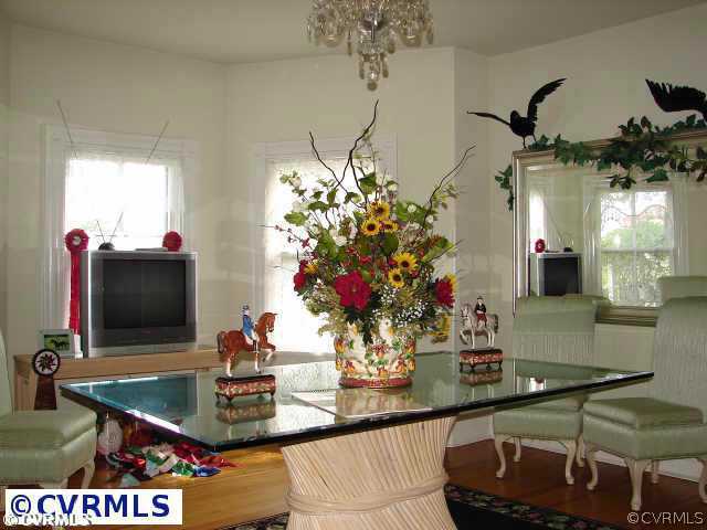 1745 Cardwell Road Crozier, VA 23039 - Photo 8 of 18 a room with a chandelier and living room view