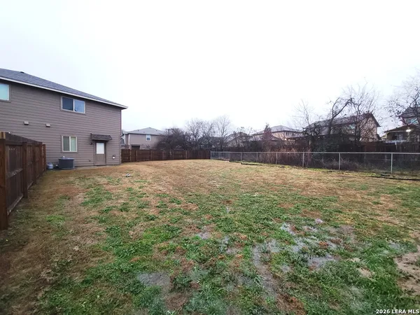 a backyard of a house with lots of green space