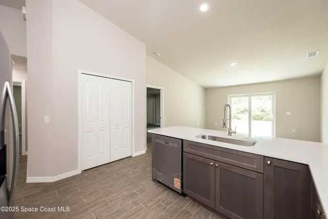 a kitchen with a sink and a window