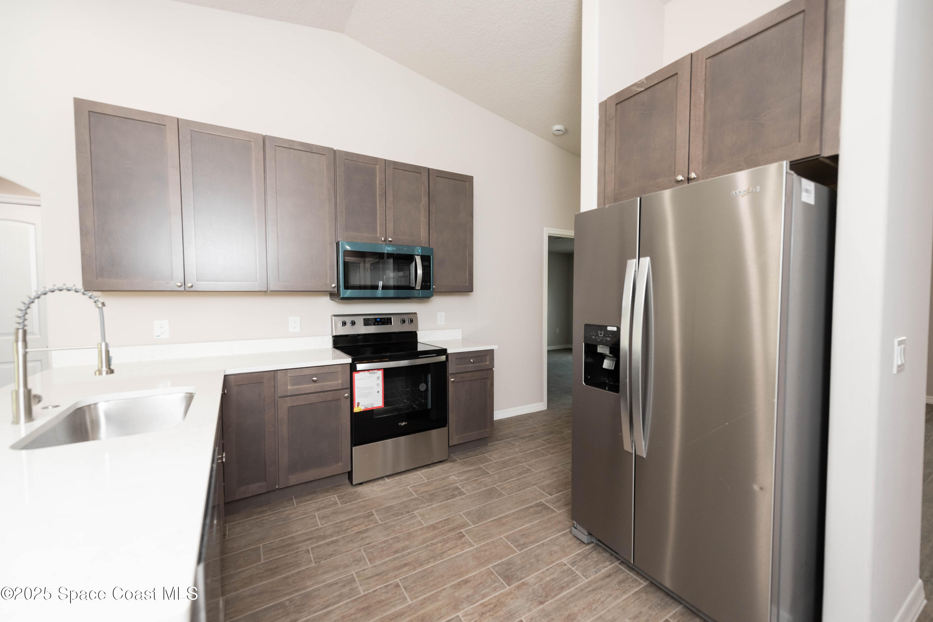 250 Frederick Street Southwest Palm Bay, FL 32908 - Photo 16 of 45 a kitchen with stainless steel appliances granite countertop a refrigerator stove a sink and dishwasher