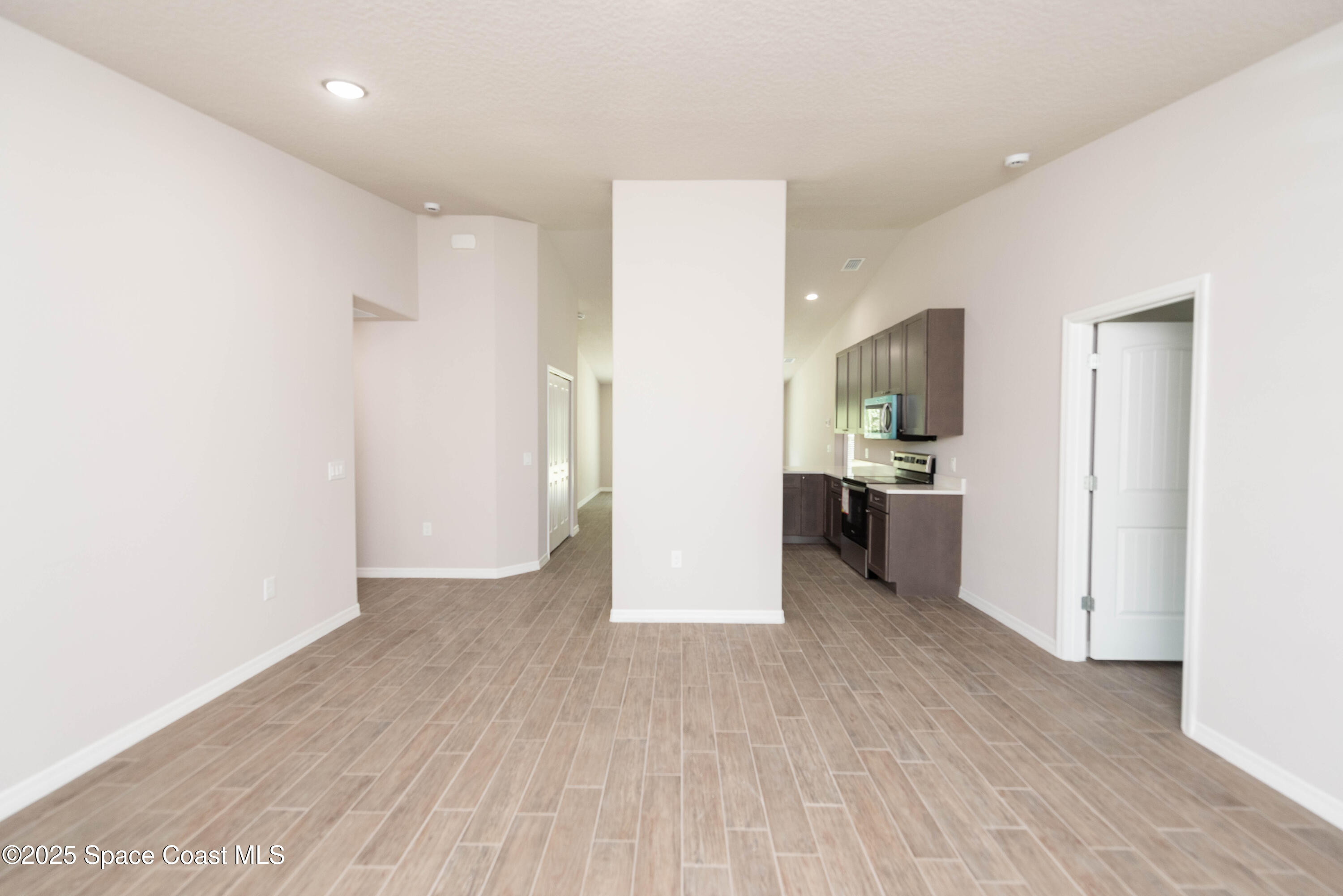 250 Frederick Street Southwest Palm Bay, FL 32908 - Photo 21 of 45 a view of a kitchen with a sink and a refrigerator
