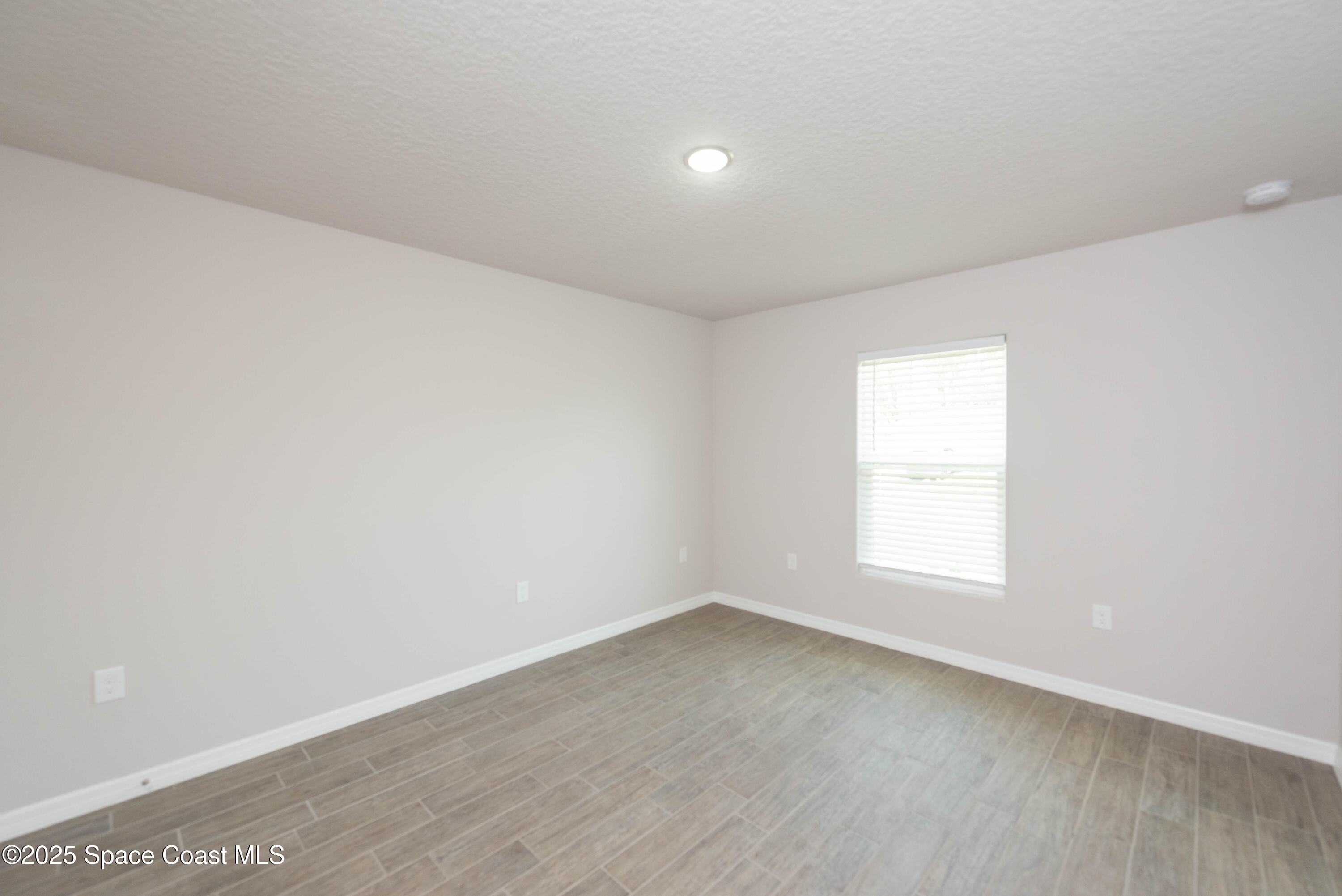 250 Frederick Street Southwest Palm Bay, FL 32908 - Photo 35 of 45 an empty room with a window