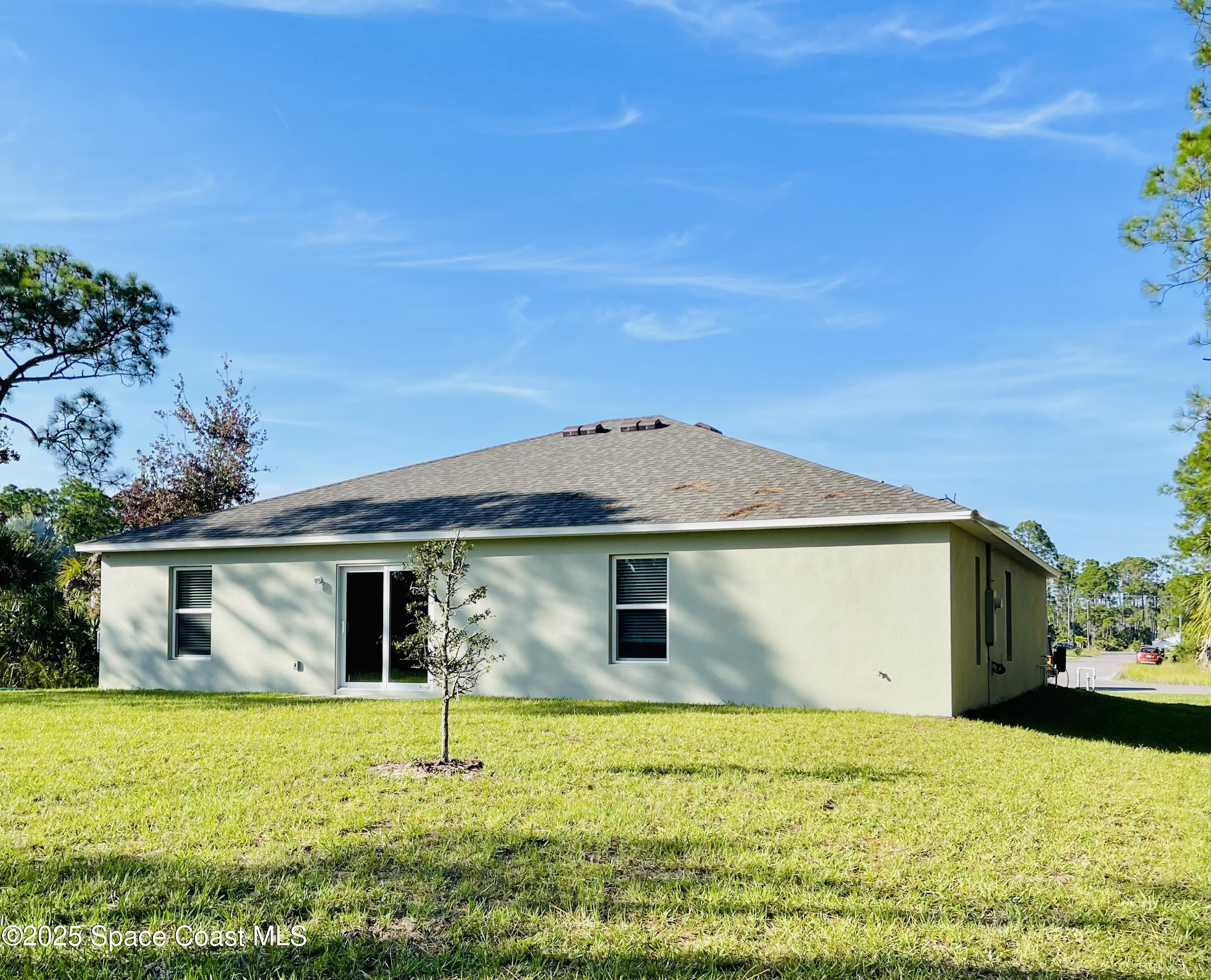 250 Frederick Street Southwest Palm Bay, FL 32908 - Photo 45 of 45 a house with yard in front of it