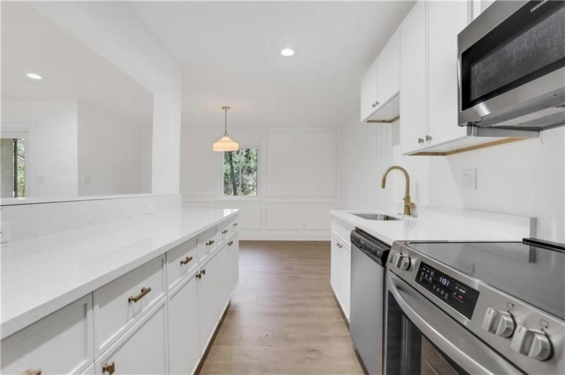 2396 Lawrenceville Highway, Unit V Decatur, GA 30033 - Photo 1 of 27 a kitchen with granite countertop a sink and a stove