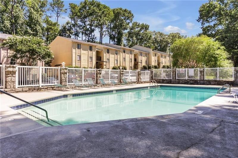 2396 Lawrenceville Highway, Unit V Decatur, GA 30033 - Photo 25 of 27 a view of a house with swimming pool and a yard