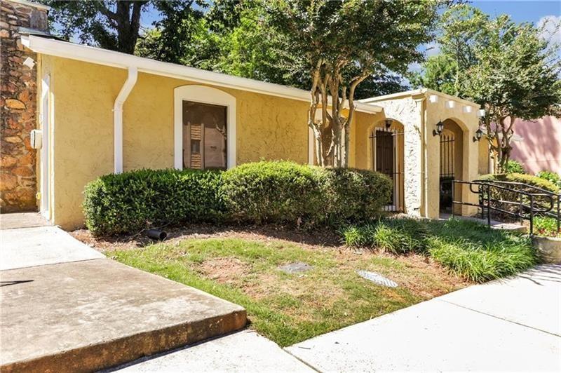 2396 Lawrenceville Highway, Unit V Decatur, GA 30033 - Photo 26 of 27 a view of a white house with wooden fence