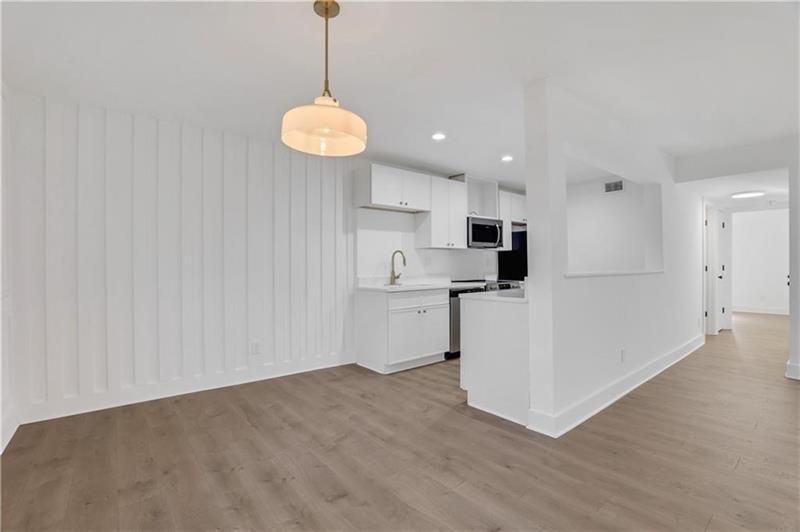2396 Lawrenceville Highway, Unit V Decatur, GA 30033 - Photo 8 of 27 a view of a kitchen with an empty space and a window