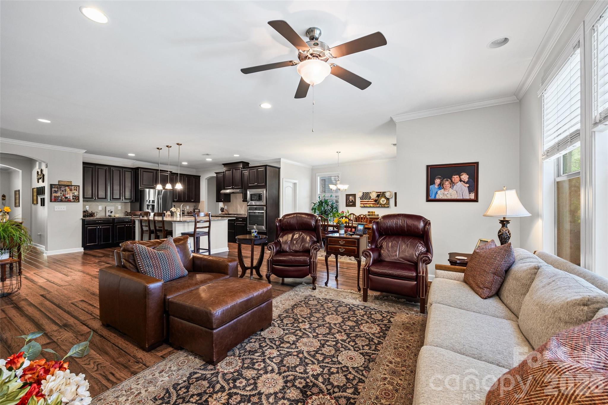 2054 Lometa Road York, SC 29745 - Photo 15 of 45 a living room with furniture kitchen view and a chandelier