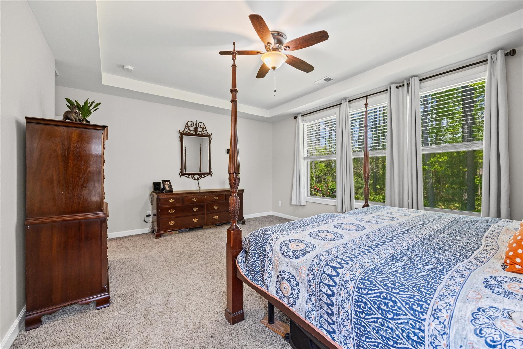 2054 Lometa Road York, SC 29745 - Photo 20 of 45 a bedroom with a bed a dresser and large window