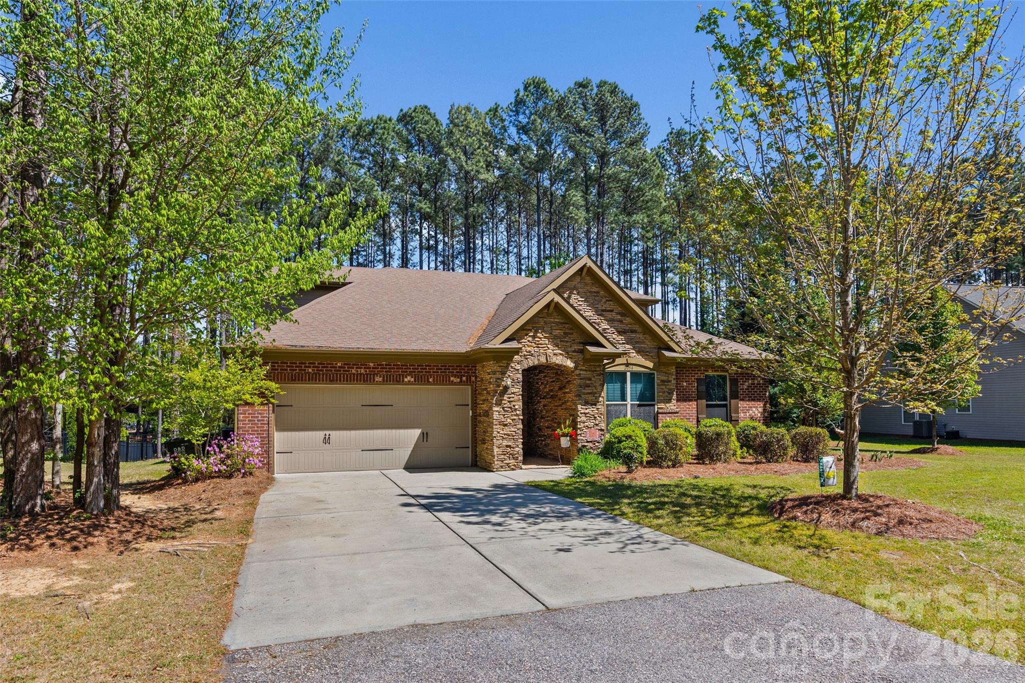 2054 Lometa Road York, SC 29745 - Photo 2 of 45 a front view of a house with garden