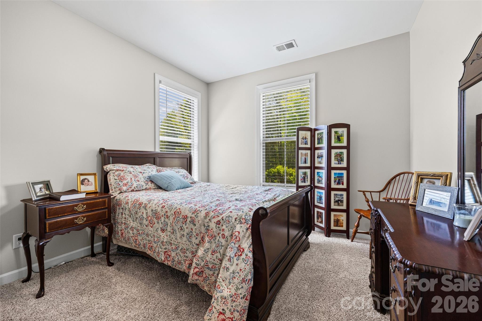 2054 Lometa Road York, SC 29745 - Photo 26 of 45 a bedroom with a bed a desk and chair with the front door