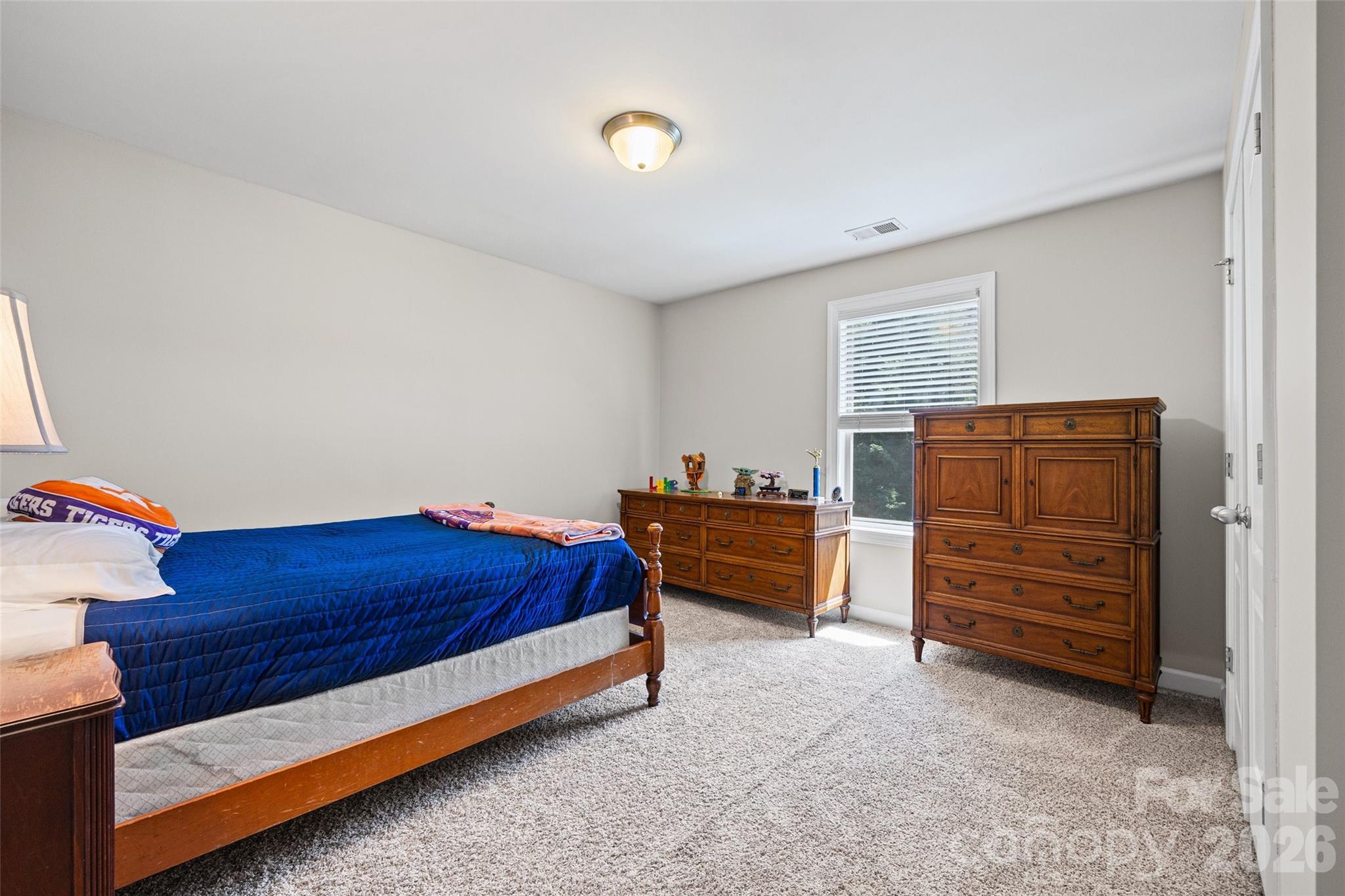 2054 Lometa Road York, SC 29745 - Photo 30 of 45 a bed room with a bed and a dresser