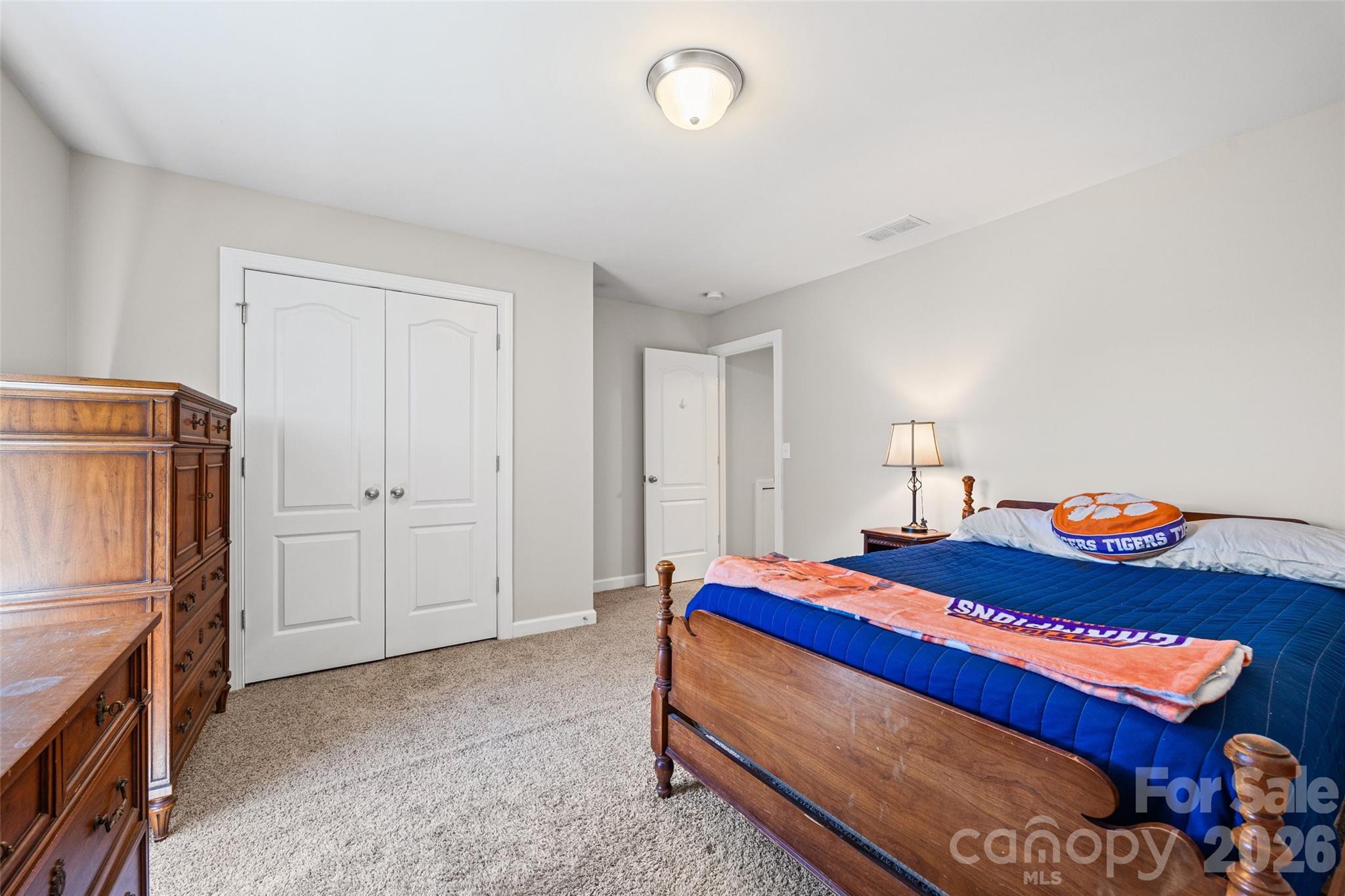 2054 Lometa Road York, SC 29745 - Photo 31 of 45 a bedroom with a bed and a refrigerator