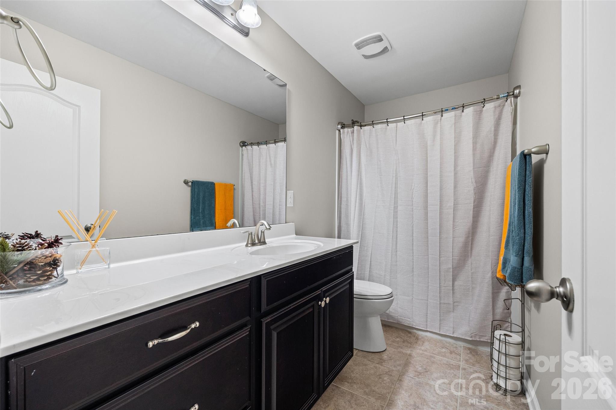 2054 Lometa Road York, SC 29745 - Photo 34 of 45 a bathroom with a double vanity sink toilet and a mirror