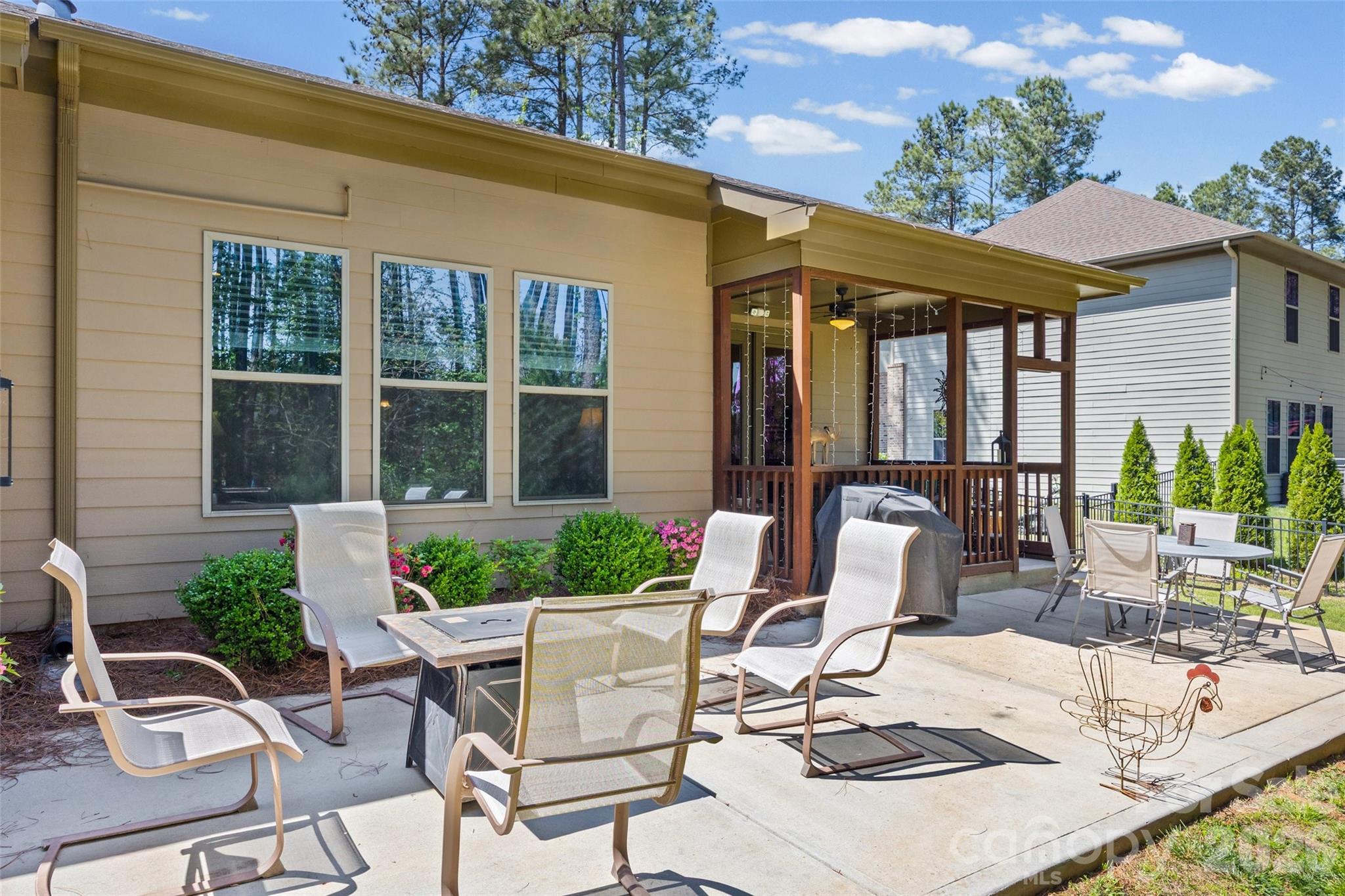 2054 Lometa Road York, SC 29745 - Photo 36 of 45 a view of a patio with table and chairs potted plants and floor to ceiling window and potted plants