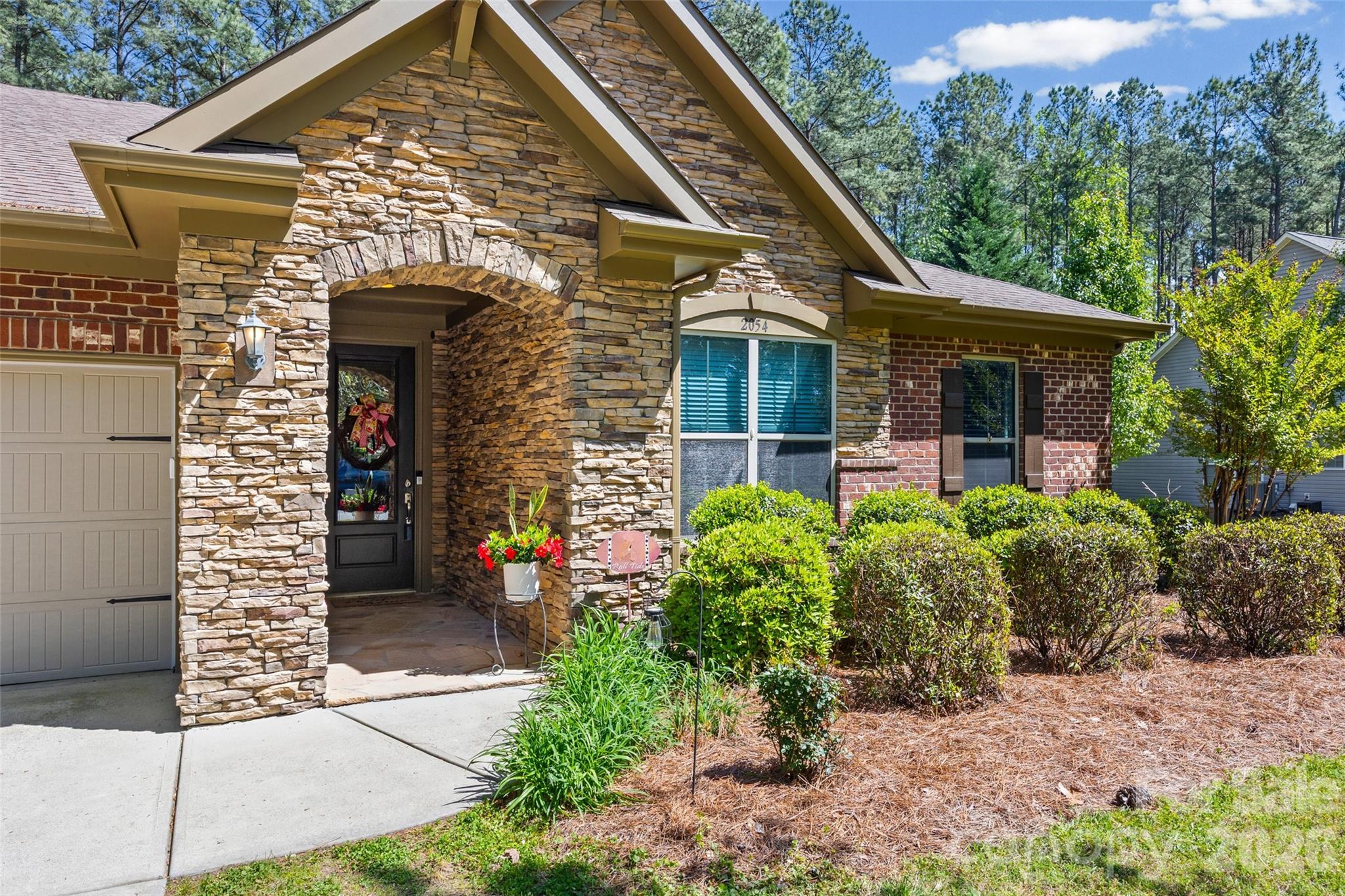 2054 Lometa Road York, SC 29745 - Photo 4 of 45 a front view of a house with garden