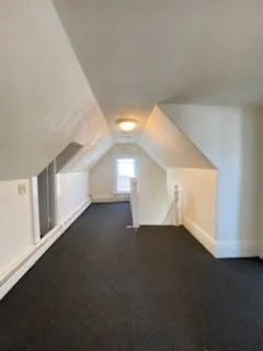 a view of an empty room with windows