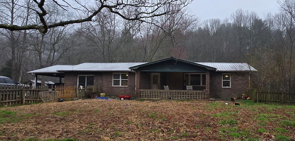 a front view of a house with yard