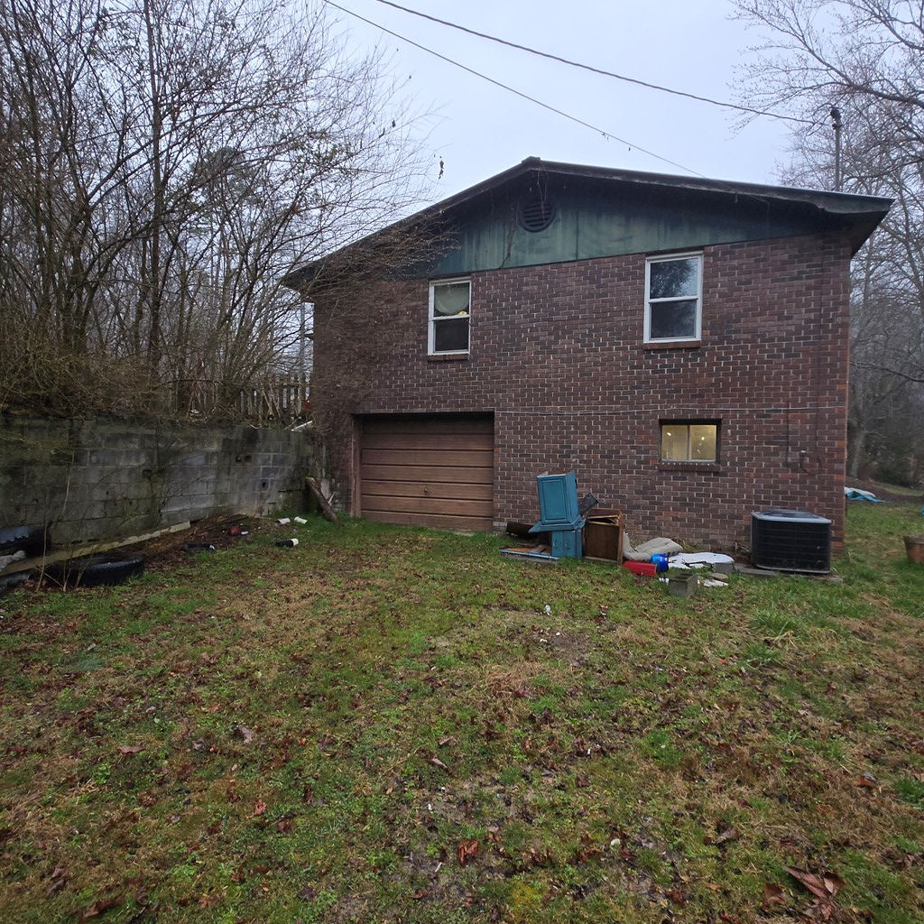 5134 Boardtown Road Ellijay, GA 30540 - Photo 20 of 41 a brick house with a yard