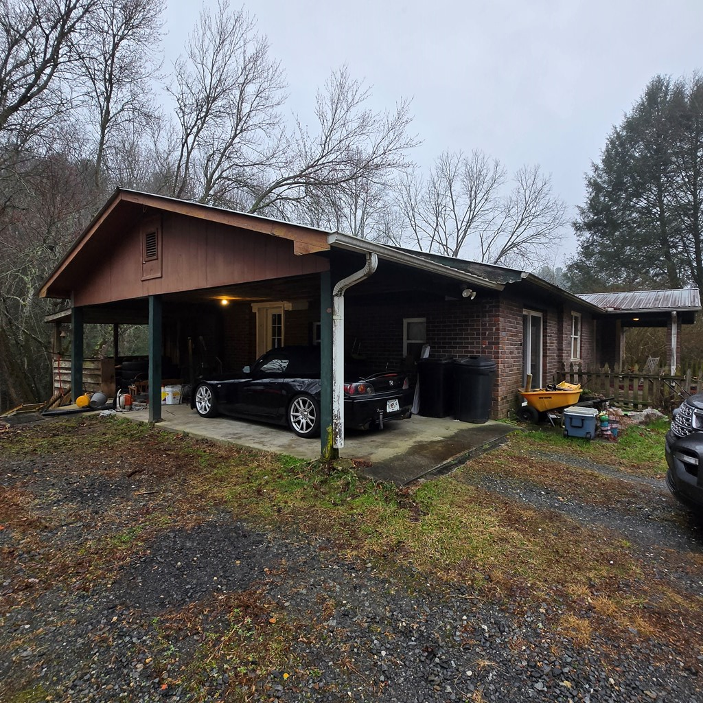 5134 Boardtown Road Ellijay, GA 30540 - Photo 3 of 41 a view of a house with a yard and garage
