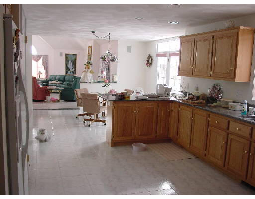 4 Hawks Ridge Road Billerica, MA 01862 - Photo 6 of 6 a view of a kitchen with cabinets and furniture