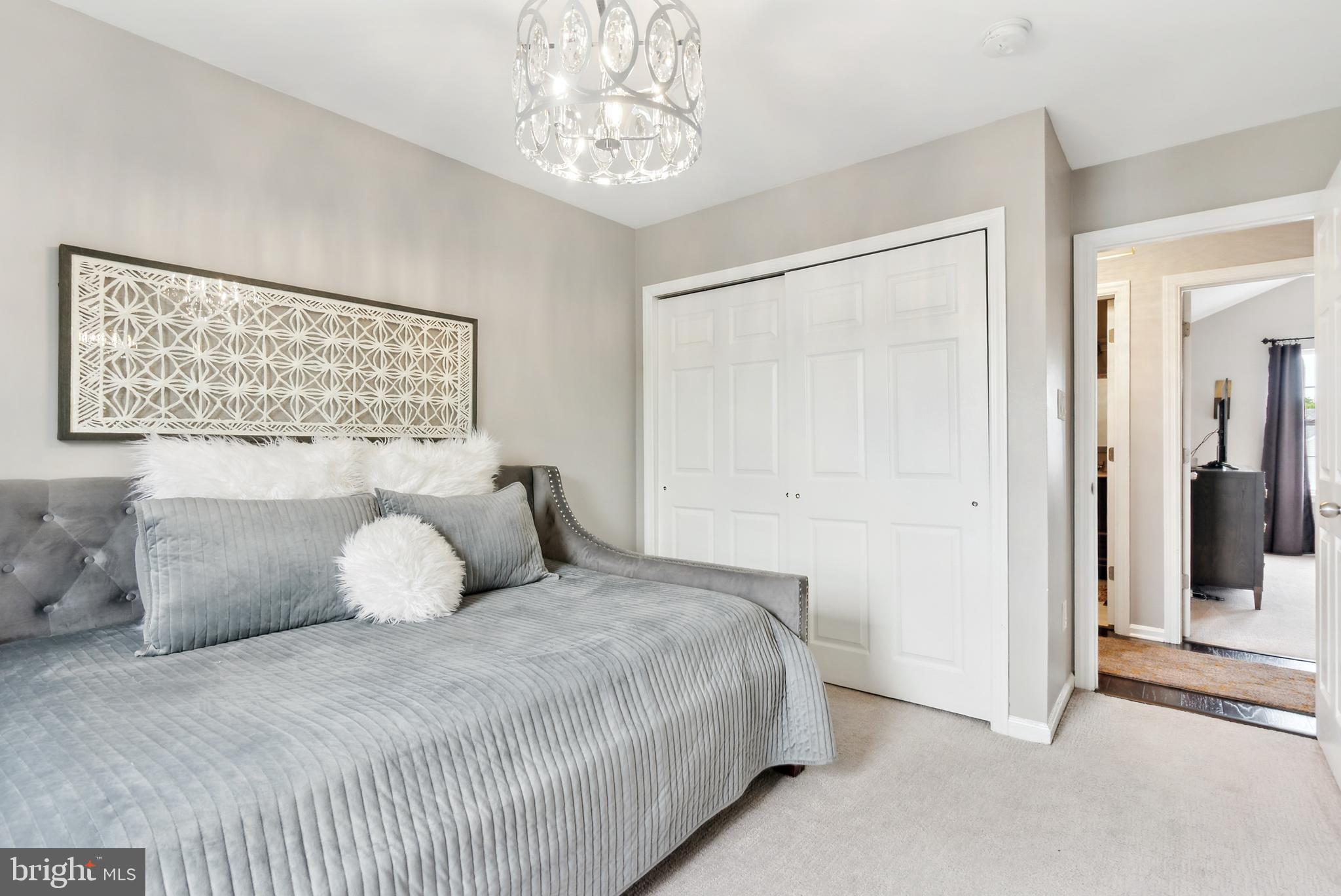 19 Phoenix Road Marlton, NJ 08053 - Photo 13 of 32 a bedroom with a bed and a chandelier