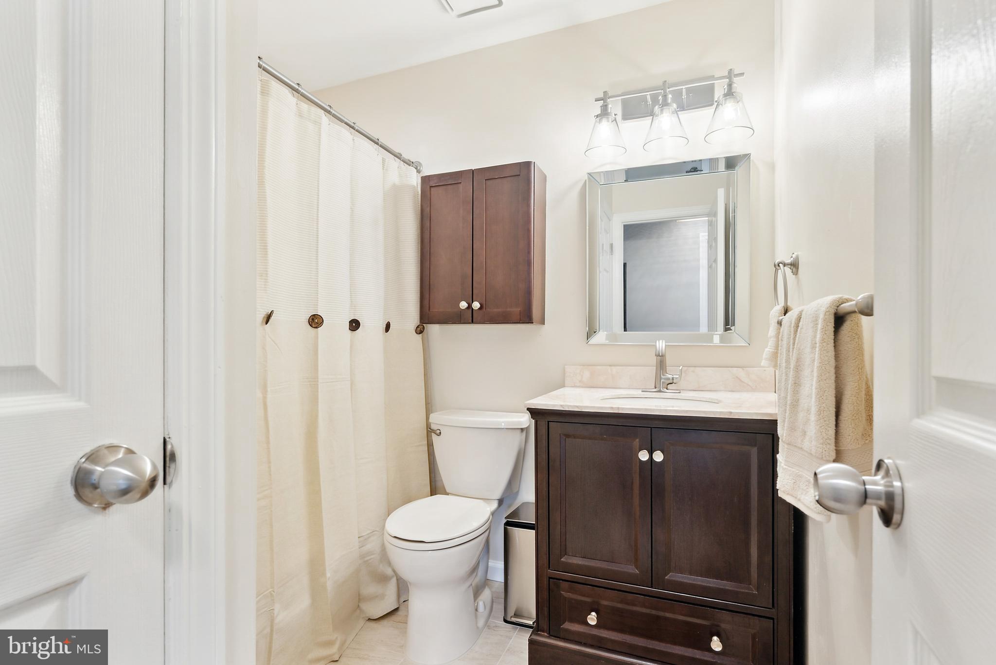 19 Phoenix Road Marlton, NJ 08053 - Photo 16 of 32 a bathroom with a sink a toilet and shower