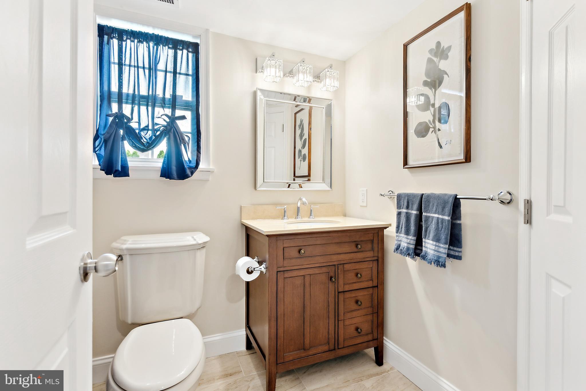 19 Phoenix Road Marlton, NJ 08053 - Photo 18 of 32 a bathroom with a toilet a sink and mirror