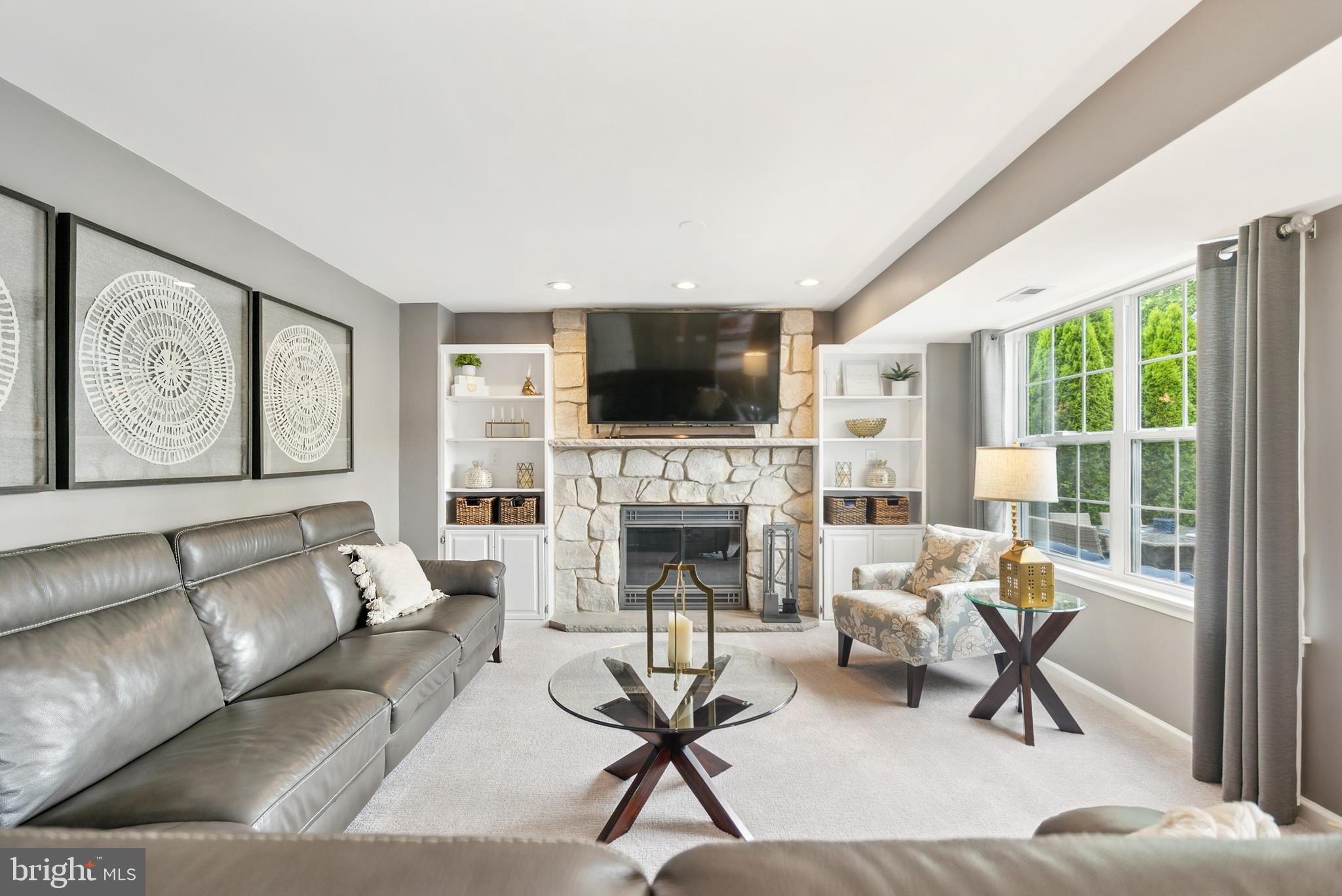 19 Phoenix Road Marlton, NJ 08053 - Photo 19 of 32 a living room with furniture a fireplace and a flat screen tv