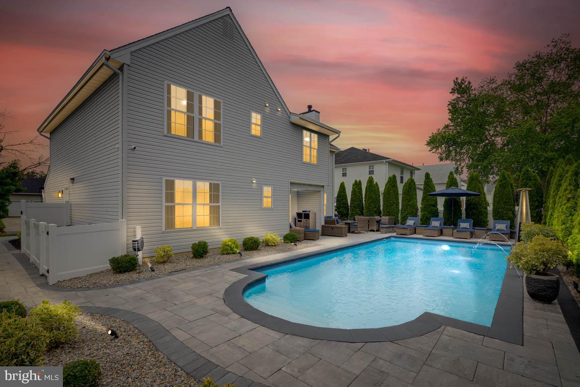 19 Phoenix Road Marlton, NJ 08053 - Photo 30 of 32 a view of a house with swimming pool and sitting area