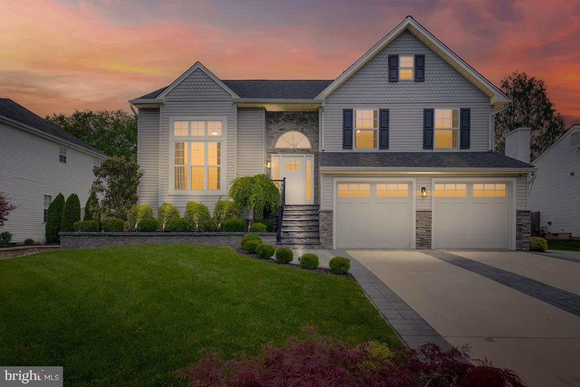 19 Phoenix Road Marlton, NJ 08053 - Photo 31 of 32 a front view of a house with a yard and garage