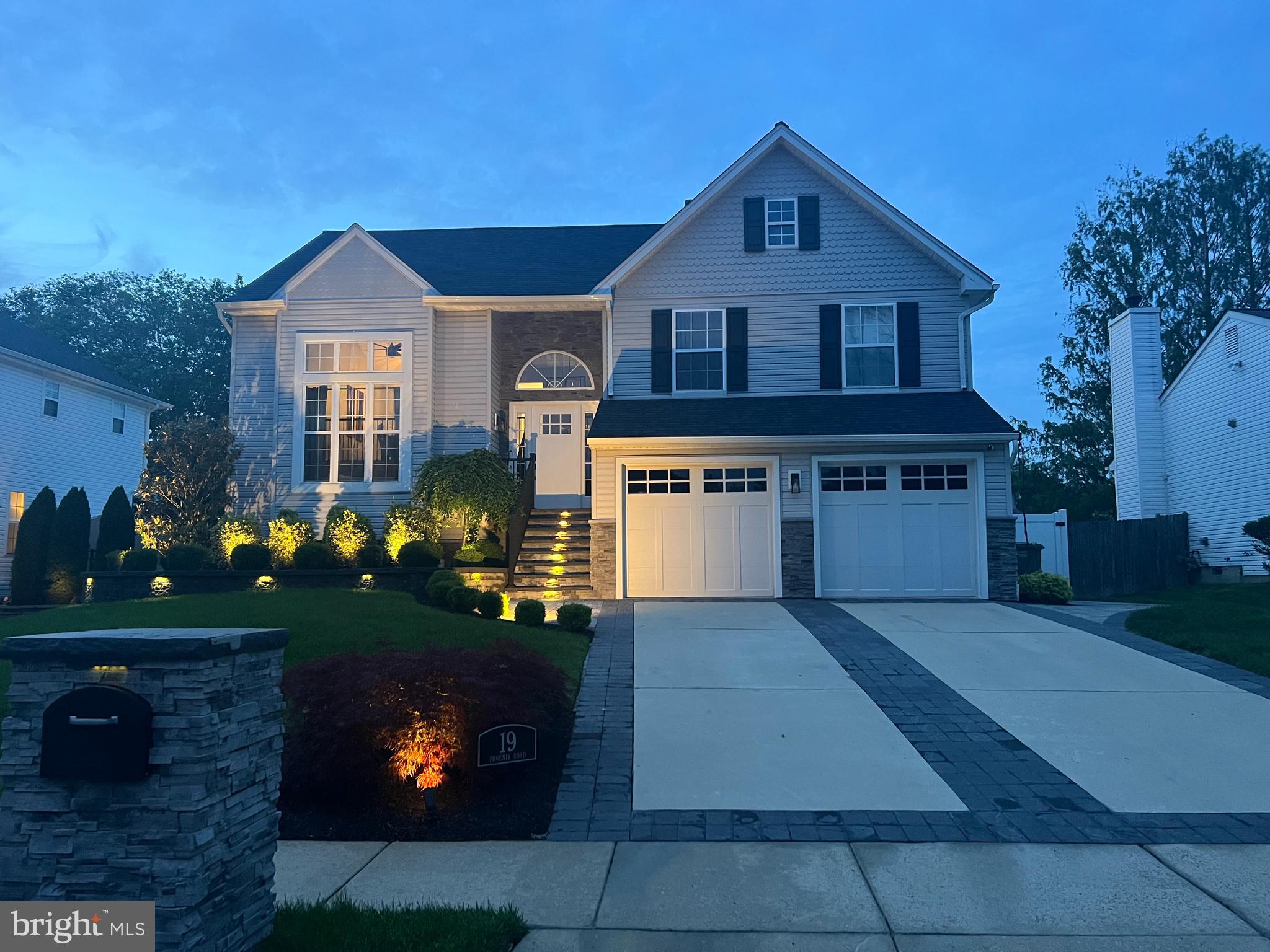 19 Phoenix Road Marlton, NJ 08053 - Photo 32 of 32 a front view of a house with a yard and garage