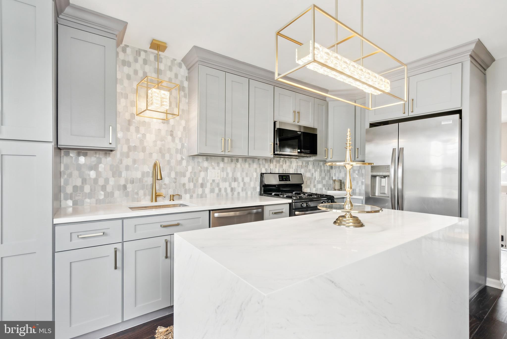 19 Phoenix Road Marlton, NJ 08053 - Photo 7 of 32 a kitchen with appliances a sink cabinets and a window