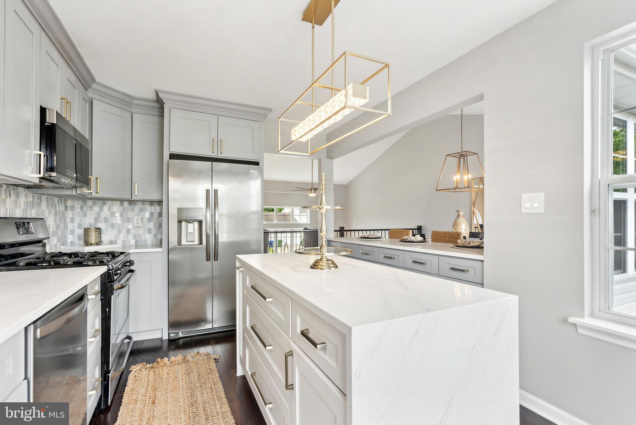 19 Phoenix Road Marlton, NJ 08053 - Photo 8 of 32 a kitchen with a sink stove and refrigerator