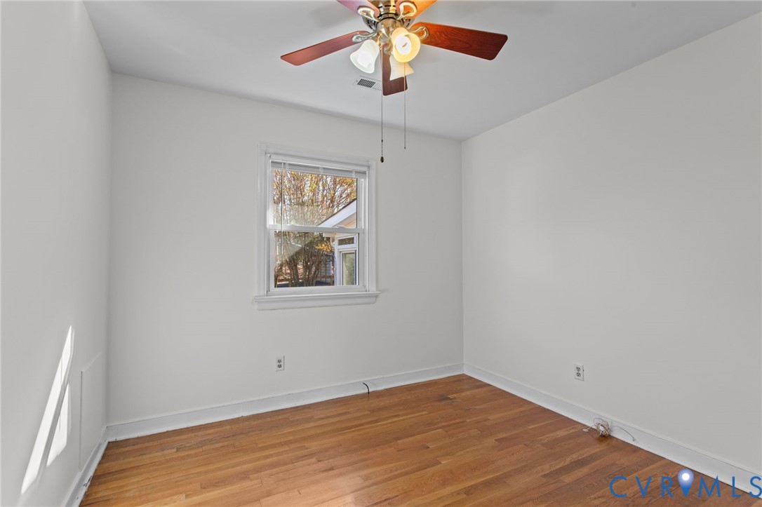 5359 Qualla Road Chesterfield, VA 23832 - Photo 18 of 49 a view of an empty room with window and a ceiling fan