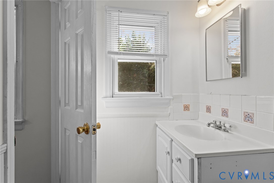 5359 Qualla Road Chesterfield, VA 23832 - Photo 30 of 49 a bathroom with a sink and a mirror