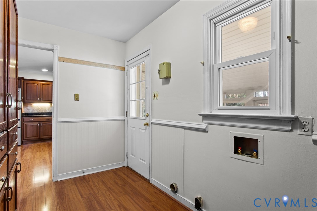 5359 Qualla Road Chesterfield, VA 23832 - Photo 32 of 49 a hallway with wooden floor fireplace and windows