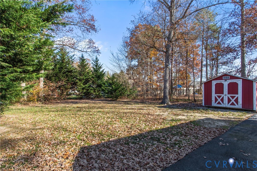 5359 Qualla Road Chesterfield, VA 23832 - Photo 5 of 49 a view of a yard with large trees