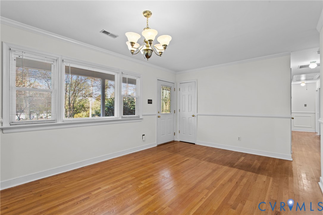 5359 Qualla Road Chesterfield, VA 23832 - Photo 9 of 49 a view of an empty room with a window and wooden floor