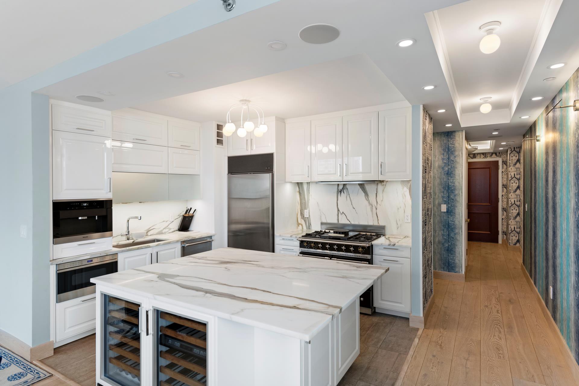 a kitchen with a sink stainless steel appliances and cabinets