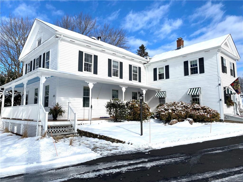 Fabulous rambling Farmhouse with wonderful wrapped porch set back on 3+ acres with Post & Beam Barn