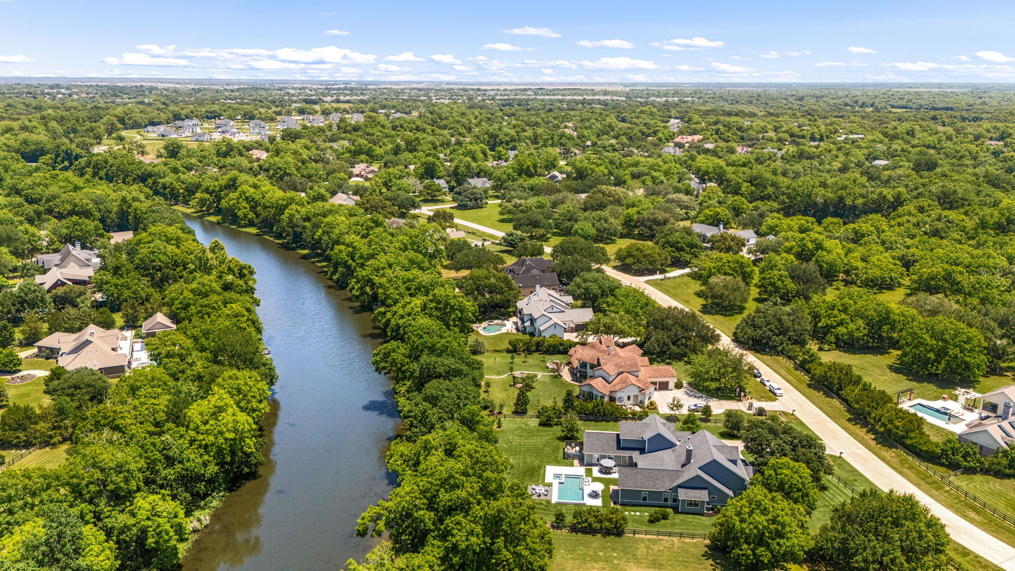 4311 Upper Oxbow Trace Fulshear, TX 77441 - Photo 49 of 49 Serene waterfront surroundings create a peaceful retreat with lush mature trees and scenic natural beauty in every direction.