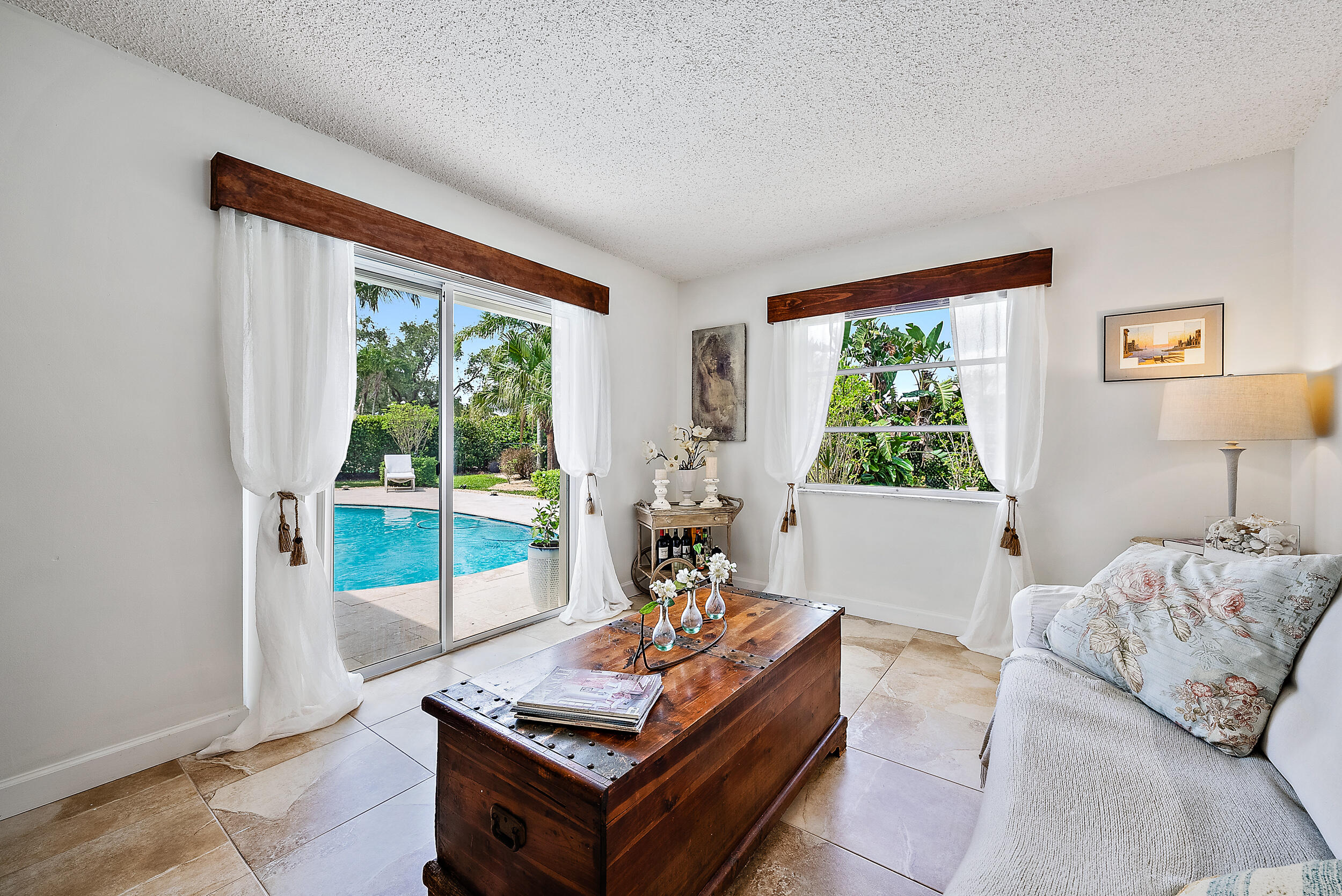 83 Fairview West Tequesta, FL 33469 - Photo 13 of 32 a living room with furniture and a flat screen tv
