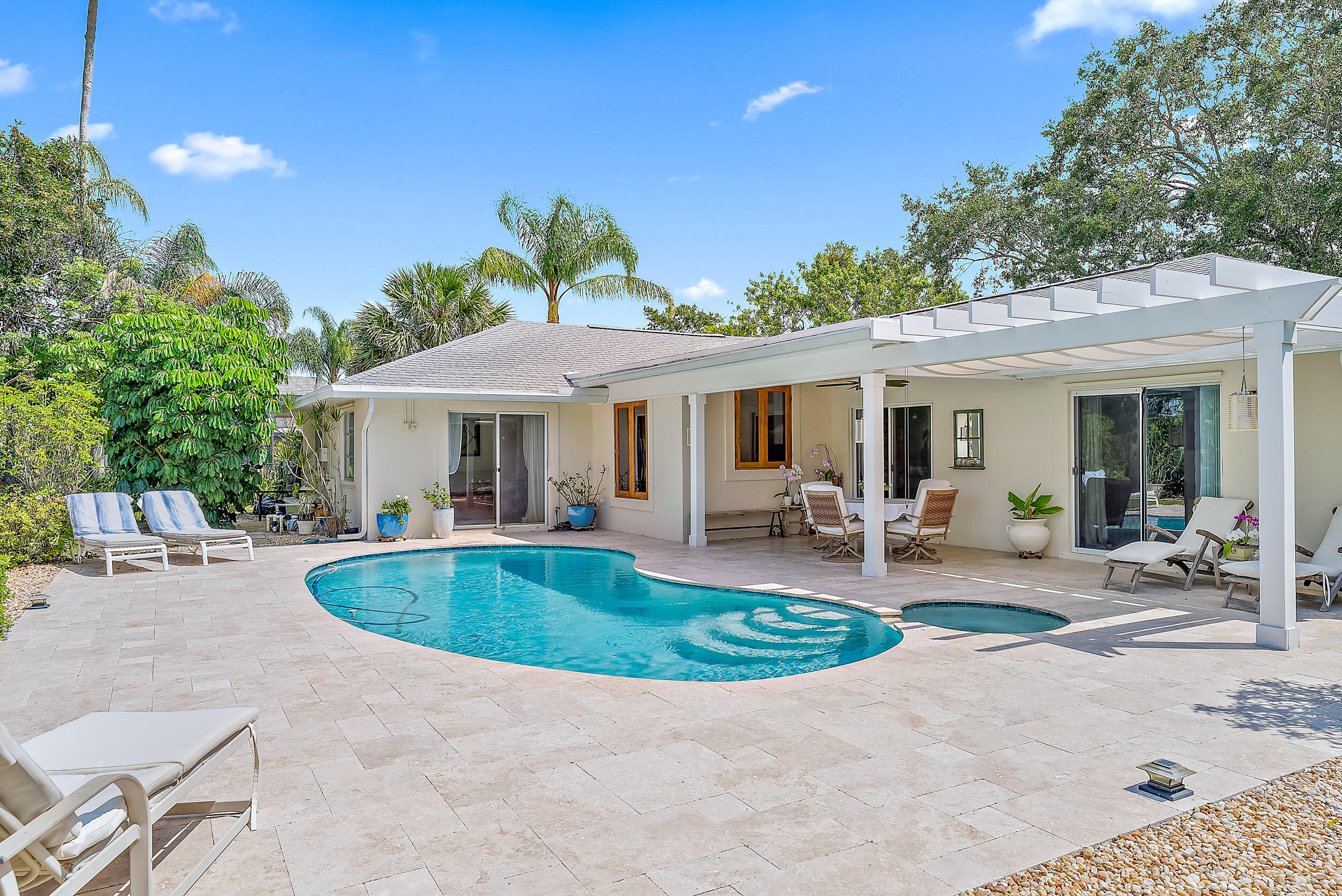 83 Fairview West Tequesta, FL 33469 - Photo 19 of 32 a view of a house with backyard and sitting area